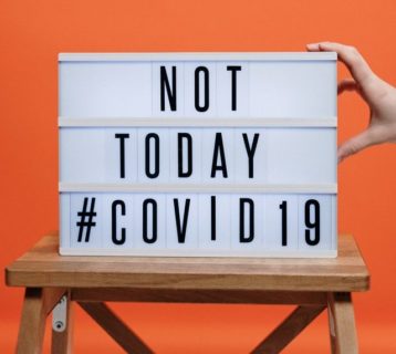 not-today-covid19-sign-on-wooden-stool-3952231-e1585152106267.jpg